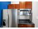 The kitchen showcases stainless steel appliances including a Whirlpool refrigerator and microwave at 8890 N Pennington Rd, Mooresville, IN 46158