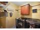 Functional laundry room with modern washer and dryer units at 8890 N Pennington Rd, Mooresville, IN 46158