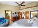 Cozy main bedroom boasts an adjacent en-suite bathroom, a comfortable seating area, and natural light at 8890 N Pennington Rd, Mooresville, IN 46158