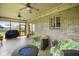 Relaxing screened-in patio with comfortable seating and outdoor grill at 8890 N Pennington Rd, Mooresville, IN 46158