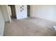 A carpeted bedroom featuring white walls and doors, with a closet for storage at 928 Hoover Village Dr # 928D, Indianapolis, IN 46260
