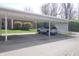 Carport featuring a silver SUV parked in a designated parking space at 928 Hoover Village Dr # 928D, Indianapolis, IN 46260