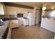 A spacious kitchen with white cabinets, appliances, and light-colored countertops at 928 Hoover Village Dr # 928D, Indianapolis, IN 46260