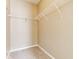 Walk-in closet with white wire shelving and neutral carpeting for efficient storage at 9763 Rolling Plain Dr, Noblesville, IN 46060