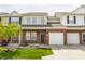 Charming townhouse featuring a brick facade, attached garage, and well-maintained landscaping at 9763 Rolling Plain Dr, Noblesville, IN 46060