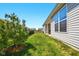Spacious backyard featuring a covered patio, lawn and view to neighboring homes at 9847 Bryce Blvd, Pendleton, IN 46064