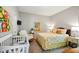 Cozy bedroom with carpet, white rocking chair, and yellow decor is perfect for a baby or guest at 9847 Bryce Blvd, Pendleton, IN 46064