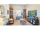 Bright bedroom with bookshelves, world map, desk, and a round table with chairs at 9847 Bryce Blvd, Pendleton, IN 46064