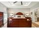 Spacious main bedroom features a tray ceiling, a ceiling fan, and a large window for plenty of natural light at 9847 Bryce Blvd, Pendleton, IN 46064