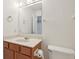 Bathroom featuring a vanity and mirror with a sink and toilet at 10861 Tealpoint Dr, Indianapolis, IN 46229