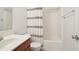 Clean bathroom with a shower/tub combo and a wood vanity sink at 10861 Tealpoint Dr, Indianapolis, IN 46229