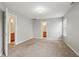 Open bedroom with plush carpeting and views to the bathroom and closets at 10861 Tealpoint Dr, Indianapolis, IN 46229