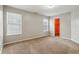 Spacious bedroom featuring neutral walls, plush carpet, and bright natural light at 10861 Tealpoint Dr, Indianapolis, IN 46229