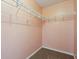 Walk-in closet with carpeted floor and white shelving for ample storage space at 10861 Tealpoint Dr, Indianapolis, IN 46229
