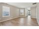 Spacious living room with two windows, light-colored floors, and neutral paint, filled with natural light at 10861 Tealpoint Dr, Indianapolis, IN 46229