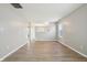 Bright living room with light gray walls, modern light-colored flooring, and ample natural light at 10861 Tealpoint Dr, Indianapolis, IN 46229