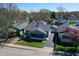 Aerial view of a charming one-story home with a well-manicured yard and cozy front porch at 1125 N Colorado Ave, Indianapolis, IN 46201
