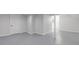 Clean, freshly painted basement with updated flooring and ample space at 1125 N Colorado Ave, Indianapolis, IN 46201