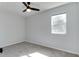 Cozy bedroom with a neutral color palette and a window providing natural light and street views at 1125 N Colorado Ave, Indianapolis, IN 46201