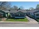 Charming one-story home with a cozy front porch and well-manicured lawn at 1125 N Colorado Ave, Indianapolis, IN 46201