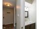 Well-lit half bathroom with vanity and marble countertop near front entryway of house at 1131 Canterbury S Sq, Indianapolis, IN 46260