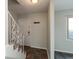 Cozy entryway featuring decorative stair railing, tiled floor, and coat hooks by the front door at 1131 Canterbury S Sq, Indianapolis, IN 46260