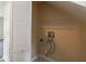 Practical laundry area with washer hookups and closet storage for household essentials at 1131 Canterbury S Sq, Indianapolis, IN 46260