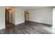 Versatile living space with hardwood flooring, open to kitchen and dining areas at 1131 Canterbury S Sq, Indianapolis, IN 46260