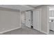 Bedroom featuring new carpet and large closet space, painted in a neutral gray at 11423 Mutz Cir, Indianapolis, IN 46229