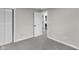 Comfortable bedroom with soft gray carpet, and a view of a doorway to the bathroom at 11423 Mutz Cir, Indianapolis, IN 46229