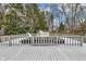 Elevated view of an above-ground pool with a deck, set in a backyard with mature trees at 11423 Mutz Cir, Indianapolis, IN 46229