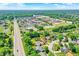 An aerial view showcases the neighborhood's proximity to shopping, roads, and community features at 11525 Capistrano Cir, Indianapolis, IN 46236