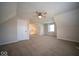 Finished attic with neutral carpet, lots of natural light, ceiling fan, and closet at 11525 Capistrano Cir, Indianapolis, IN 46236