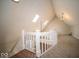 Spacious attic area featuring skylights, white railing and finished floors and walls at 11525 Capistrano Cir, Indianapolis, IN 46236