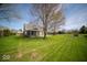 Spacious backyard with mature trees, offering a serene and private outdoor space at 11525 Capistrano Cir, Indianapolis, IN 46236