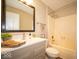 Well-lit bathroom with a neutral color scheme, featuring a modern vanity and a combined shower-tub at 11525 Capistrano Cir, Indianapolis, IN 46236