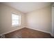 Bright bedroom with stylish flooring, a window for natural light, and a minimalist design at 11525 Capistrano Cir, Indianapolis, IN 46236