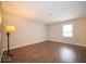 Comfortable bedroom with flooring, offering ample space and natural light through a window at 11525 Capistrano Cir, Indianapolis, IN 46236