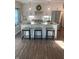 Bright, airy kitchen featuring a breakfast bar, stainless appliances, granite countertops, and pendant lighting at 11525 Capistrano Cir, Indianapolis, IN 46236
