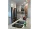 Kitchen showcasing stainless steel appliances, granite countertops, and a charming pantry area at 11525 Capistrano Cir, Indianapolis, IN 46236