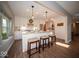 Modern kitchen featuring white cabinets, stainless steel appliances, and an island with seating, perfect for entertaining at 11525 Capistrano Cir, Indianapolis, IN 46236