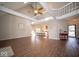 Spacious living room with high ceilings, ceiling fan, open floor plan, and hardwood floors at 11525 Capistrano Cir, Indianapolis, IN 46236