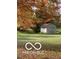A cozy storage shed in a colorful Autumn setting with a large maple tree at 11525 Capistrano Cir, Indianapolis, IN 46236