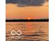 Beautiful sunset over the lake with calm water at 11525 Capistrano Cir, Indianapolis, IN 46236