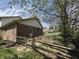 Well-maintained backyard featuring a wooden fence, brick exterior, and healthy lawn at 1235 Cottonwood Ct, Carmel, IN 46033
