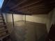 Unfinished basement with exposed ceiling, concrete flooring, support beams and limited natural light at 1235 Cottonwood Ct, Carmel, IN 46033