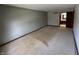 Roomy bedroom with carpeting and doorway to the bathroom at 1235 Cottonwood Ct, Carmel, IN 46033
