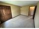 Bedroom featuring carpet, base trim, and large closet space at 1235 Cottonwood Ct, Carmel, IN 46033