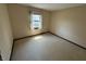 This bedroom offers a carpeted floor and a window view at 1235 Cottonwood Ct, Carmel, IN 46033
