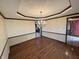 Formal dining room with classic chandelier lighting and hardwood flooring throughout at 1235 Cottonwood Ct, Carmel, IN 46033